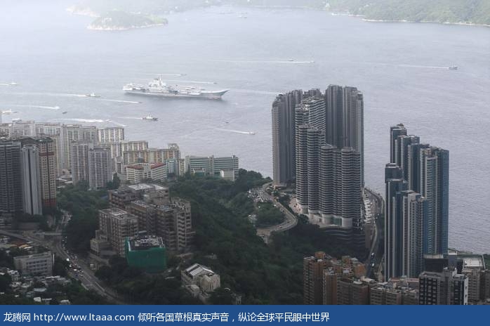 Tourists and residents gathered to catch a glimpse of the massive carrier on its maiden visit to Hong Kong part of celebrations marking 20 years since the handover of the city from British to Chinese rule