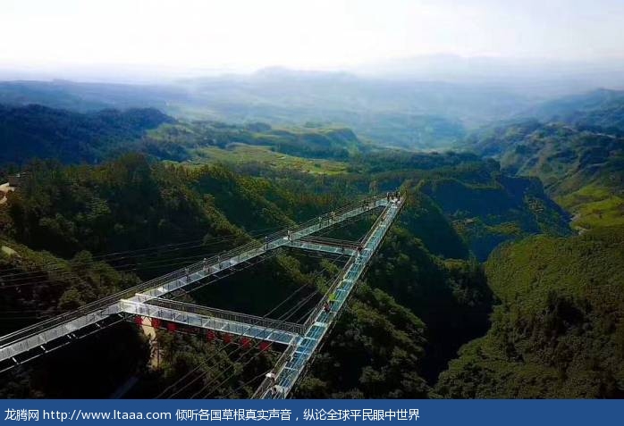 The glass-bottomed walkway in China is built on the side of a cliff face at 390ft high and extends 262 feet into the air