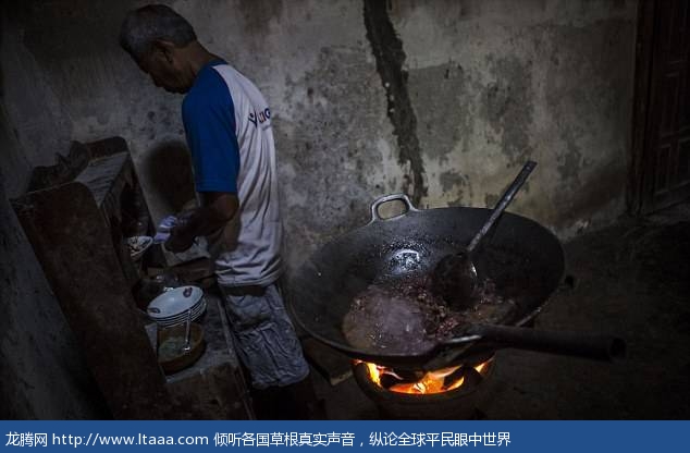 One man is seen cooking dog meat at a restaurant which specialises in cooking the animals