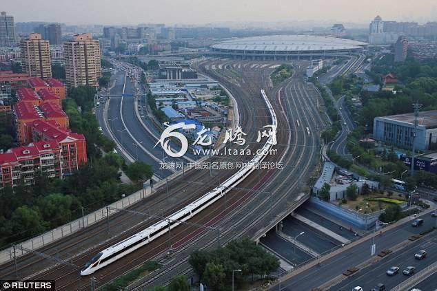 Lightning speed: A Fuxing bullet train departs from Beijing South Railway Station to Shanghai as the country restores the world's fastest bullet train which runs at 217 mph (350 kmh)