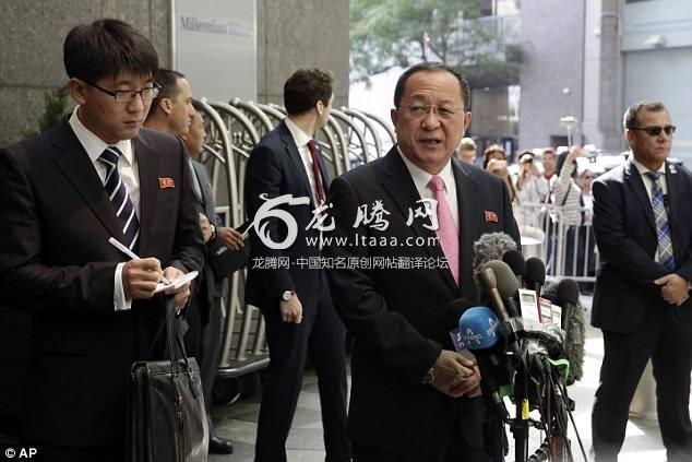 North Korea's Foreign Minister Ri Yong Ho centre speaking through an interpreter left talks outside the UN Plaza Hotel in New York today