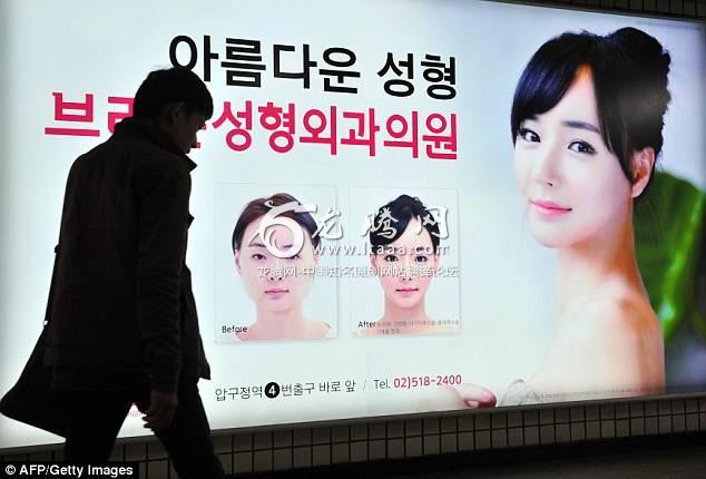 South Korea has become a top plastic surgery destination for Chinese women in the past decade and a half. In the file photo a pedestrian walks past an advertisement for plastic surgery clinic at a subway station in Seoul