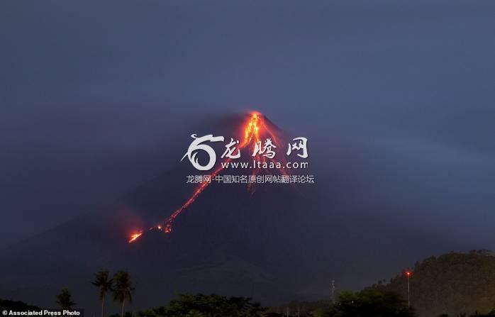 Lava is continuing to cascade down the slopes of Mayon volcano as seen from Legazpi city Albay province about 210 miles south-east of Manila