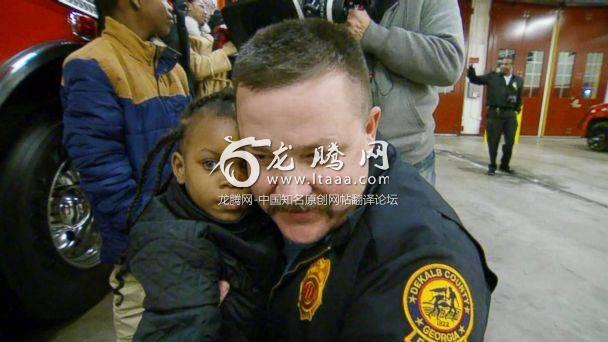 PHOTO: Destiny Nelson 5 reunites with Captain Scott Stroup of the Dekalb County Fire Rescue Department the man who caught her when she was thrown to safety from the balcony of a burning apartment building. (ABC News)