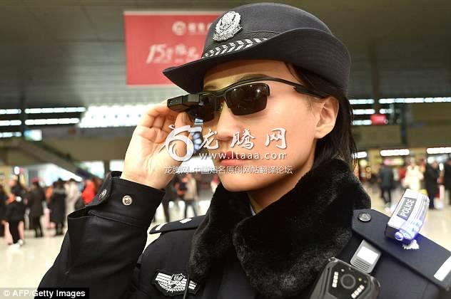 Party like it's 1984: A police officer in in China's central Henan province is seen wearing a pair of smartglasses with a facial recognition system this month