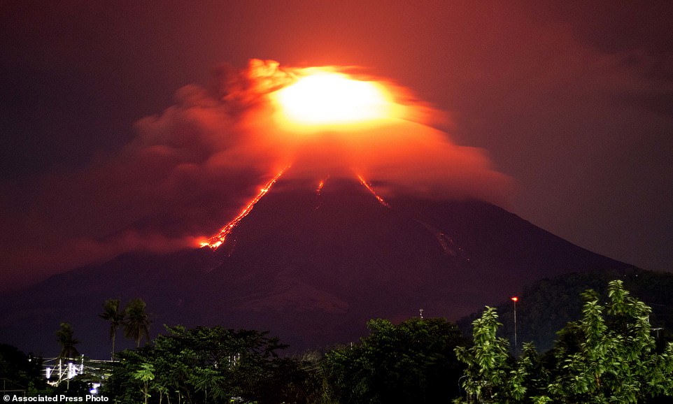 Lava cascades down the slopes of Mayon volcano as fears increase the mountain could become even more explosive