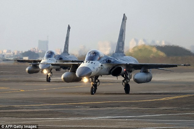 Taiwanese fighter jets  taxi on the runway during an annual drill in Tainan this morning