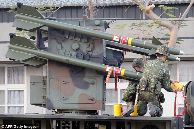 Taiwan soldiers sort the home-made Tien Chien surface-to-air missiles during an annual drill in Tainan