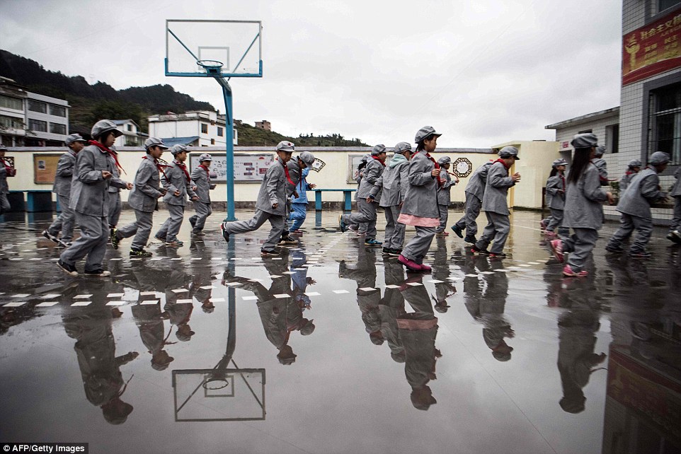 Like all buildings in China's south the school has no central heating - instead children take breaks every hour or so to perform guided exercises in the courtyard to get their blood pumping