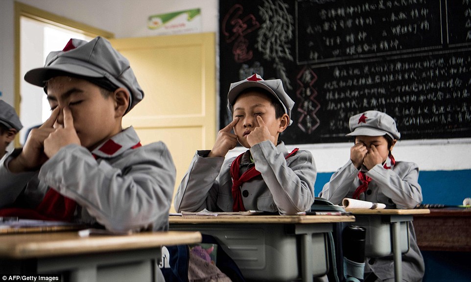 Every afternoon they spend five minutes using their fingertips to massage the area around their eyes to relax before the last round of classes – a practice taught in all Chinese schools