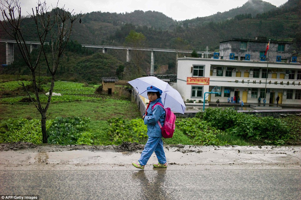 Students walk at most half an hour to get to school every day through roads often muddied by the region's fine persistent rain stopping at small roadside shops to buy neon-hued sugary packaged snacks