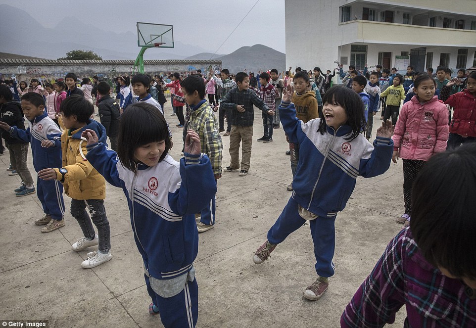 Luo Hangni 11 does exercises with classmates at a local school in Anshun China