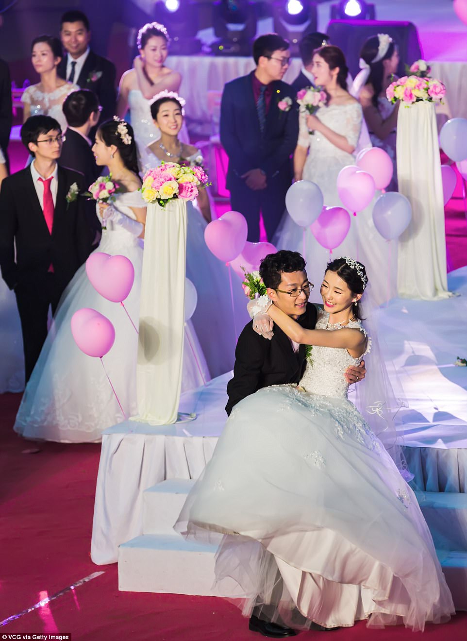 The university's motto includes the phrase 'Sincerity with aspiration' - but with all that carrying on their big day maybe also a hint of perspiration for these newlyweds