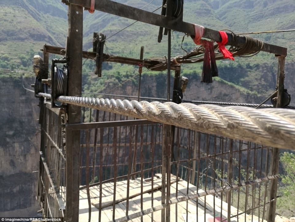 The cableway, operated by locals themselves, charges commuters five yuan (58p) for a one-way ride across the river valley