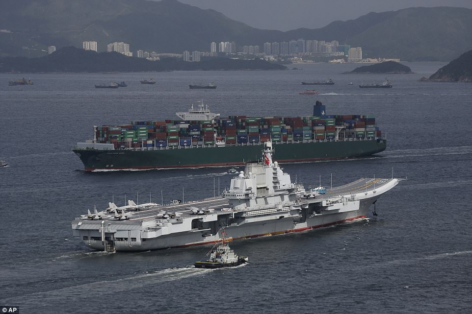 Police boats sounded horns to prevent private vessels getting any closer than a few hundred meters of the Liaoning