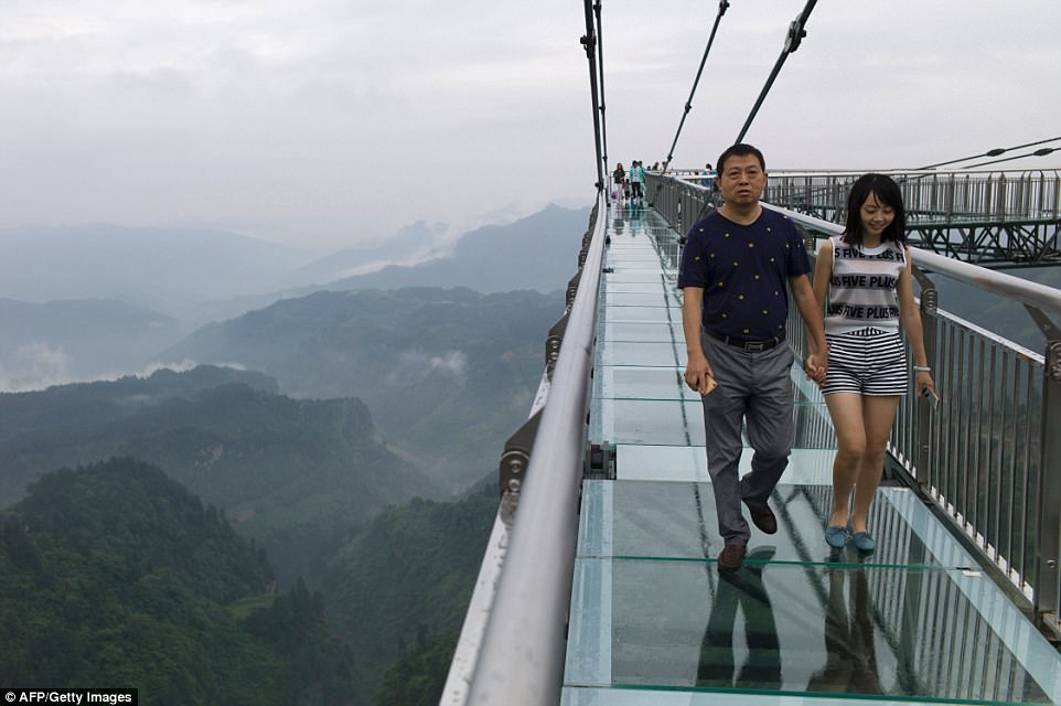 Hovering nearly 400 feet above a gaping chasm the skywalk  delights and terrifies Chinese visitors at the same time