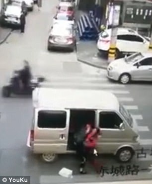 The girl is forcefully dragged and brought into the van