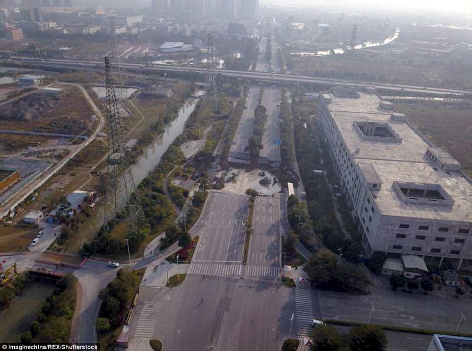 The sinkhole is the size of two basketball courts and swallowed the two-way thoroughfare in the city's Changcheng district