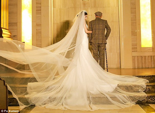 Special moment: The 25-year-old from China let her grandfather walk her down the aisle