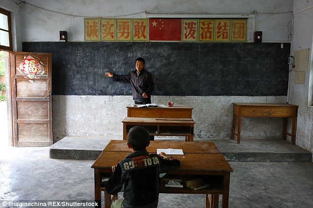 Xu Zefeng stays at a rural primary school teaching his only student Xu Jiaqi in central China