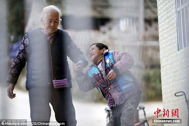 She is the sole care of the nine-year-old Haowen whose father works in another city