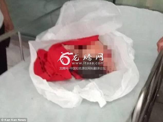 A newborn girl has been saved after her grandmother tossed her away on the road in China 