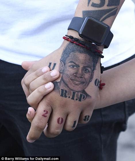 Lisandro had his son's face tattooed onto his hand in a tribute to him after his brutal death 